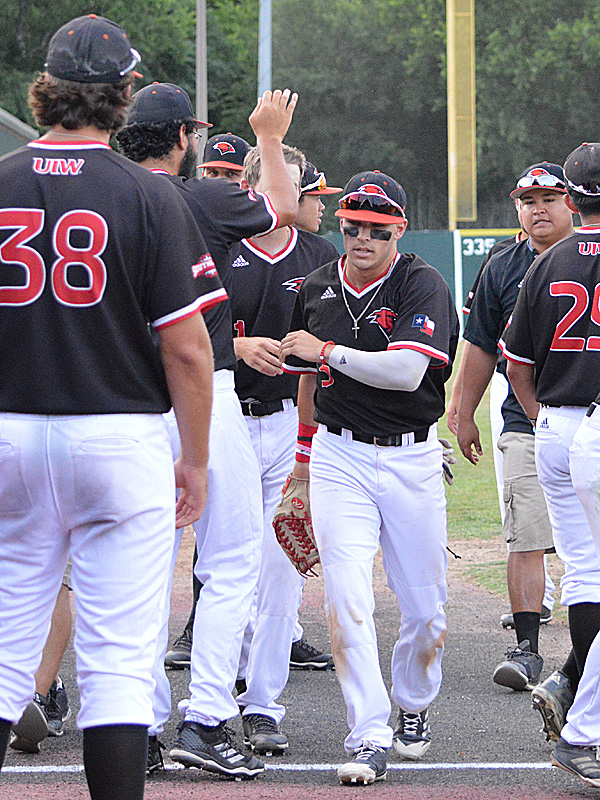 Incarnate Word outfielder Ridge Rivers is congratulated by teammates after making a catch against the wall against Sam Houston State. - photo by Joe Alexander