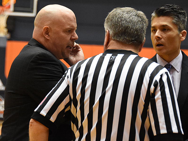 Steve Henson speaks with a referee on the sideline last weekend during a game against Southeastern Oklahoma. - Photo by Joe Alexander