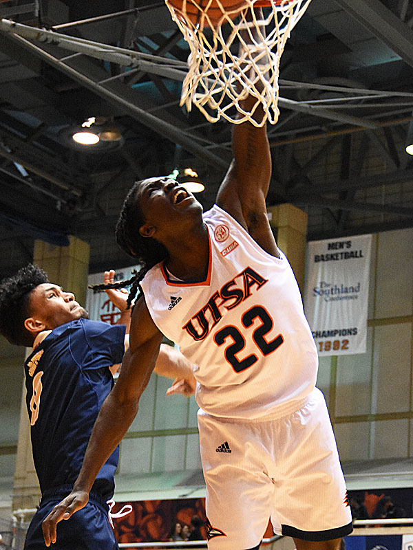 UTSA guard Keaton Wallace throws down a dunk in the second half of the Roadrunners' 100-67 victory over Florida International on Thursday at the Convocation Center. - photo by Joe Alexander
