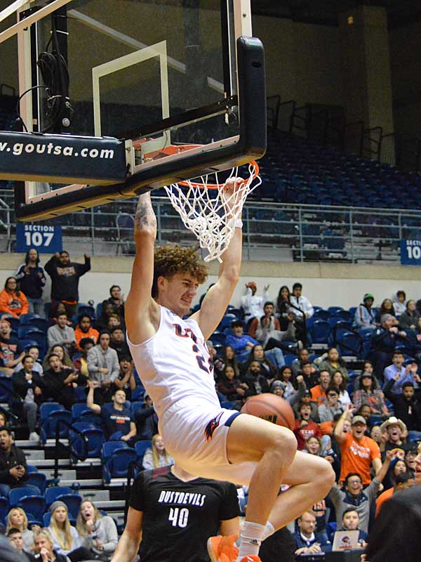 UTSA freshman Jacob Germany throws down a dunk on Wednesday, Oct. 30. 2019 at the UTSA Convocation Center. The Roadrunners beat Texas A&M International 89-60 in an exhibition game. - photo by Joe Alexander