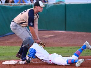 The Flying Chanclas' Jordan Thompson slides into third with a fifth-inning triple against the Brazos Valley Bombers on Thursday at Wolff Stadium. Thompson also walked and scored twice. - photo by Joe Alexander