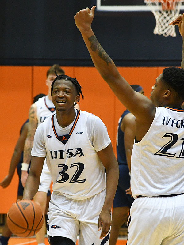 Isaiah Addo-Ankrah and Jordan Ivy-Curry celebrate after Addo-Ankrah grabbed the final rebound of the game. UTSA beat Florida International 73-66 on Thursday, Jan. 27, 2022, at the Convocation Center. - photo by Joe Alexander