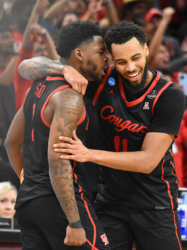 Houston's Jamal Shead, Kyler Edwards. No. 5 seed Houston upset No. 1 seed Arizona 72-60 in the NCAA tournament South Region Sweet 16 on Thursday, March 24, 2022, at the AT&T Center. - photo by Joe Alexander
