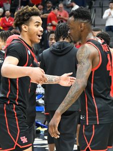 Houston's Ramon Walker Jr. (left) and Taze Moore celebrate late in Thursday's game. No. 5 seed Houston upset No. 1 seed Arizona 72-60 in the NCAA tournament South Region Sweet 16 on Thursday, March 24, 2022, at the AT&T Center. - photo by Joe Alexander