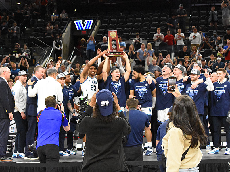 Villanova celebrates with the South Region trophy. Villanova beat Houston 50-44 in the NCAA tournament South Region on Saturday, March 26, 2022, at the AT&T Center to clinch a spot in the Final Four. - photo by Joe Alexander
