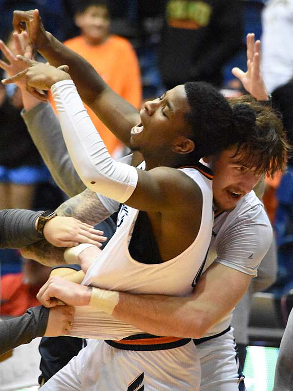 Jacob Germany (right) hugs teammate John Buggs III after Buggs hit the winning 3-pointer at the buzzer in UTSA's 75-72 Conference USA victory over Middle Tennessee on Thursday, Jan. 5, 2023, at the Convocation Center. - Photo by Joe Alexander