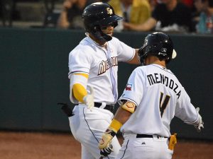 Evan Mendoza, who homered in the second inning, congratulates Tirso Ornelas after Ornelas homered in the third. The San Antonio Missions beat the Frisco RoughRiders 4-0 on Tuesday, April 11, 2023, at Wolff Stadium in the Missions' home opener. - Photo by Joe Alexander