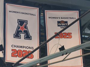 Banners honoring the accomplishments of UTSA's 2024-25 women's basketball team are unfurled on Thursday night at the Convocation Center. - Photo by Joe Alexander