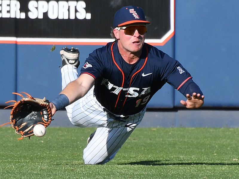 Lane Haworth dives for a line drive in right field. The ball bounced before he could reach it and it wasn't a catch. UTSA vs. UT-Arlington baseball on Friday, March 13, 2026, at Roadrunner Field. - Photo by Joe Alexander